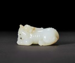 A CHINESE WHITE JADE CARVING OF A MYTHICAL BEAST, QING OR LATER