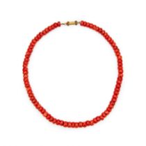 A STRAND OF CORAL BEADS