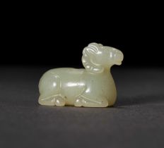 A CELADON JADE CARVING OF A RAM, QING DYNASTY (1644-1911)