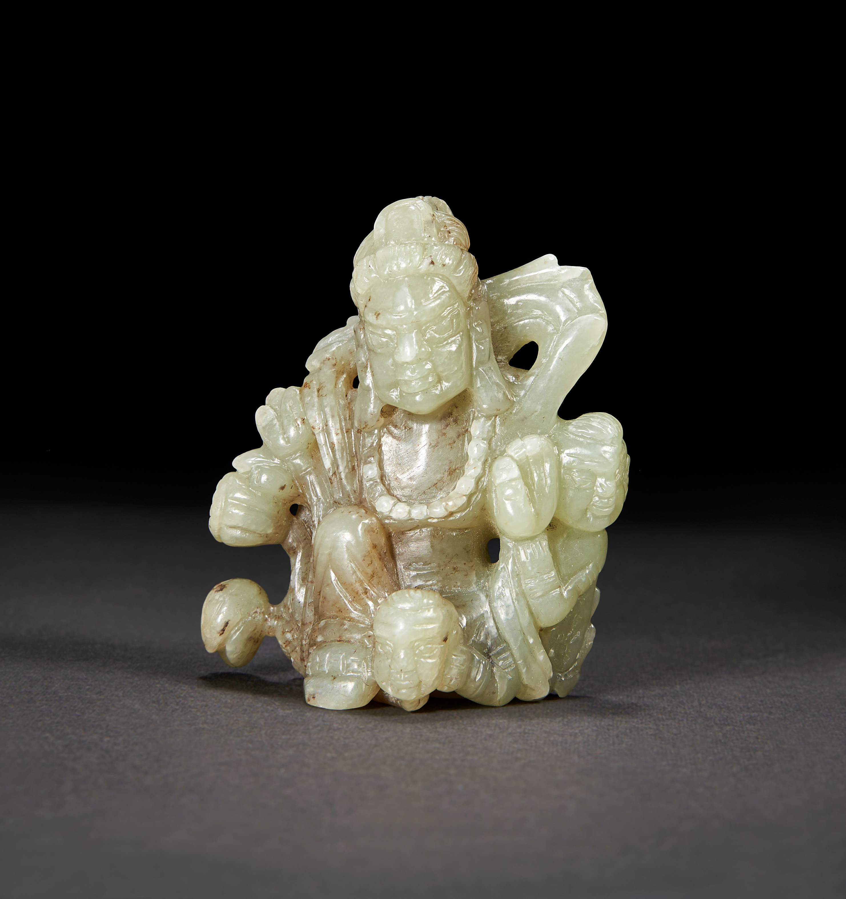 A PALE CELADON JADE CARVING OF A DHARMAPALA, QING DYNASTY (1644-1911)