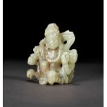 A PALE CELADON JADE CARVING OF A DHARMAPALA, QING DYNASTY (1644-1911)