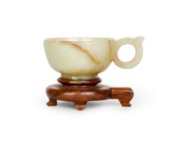 A CHINESE WHITE JADE HANDELED CUP, 18TH CENTURY