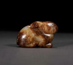 A CHINESE RUSSET JADE HARE, MING DYNASTY (1368-1644)