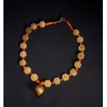 A BUKHARA GOLD & CORAL NECKLACE, 20TH CENTURY