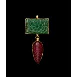 AN INDIAN CARVED EMERALD & RUBY PENDANT, 19TH/20TH CENTURY