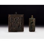 TWO BRONZE BYZANTINE INSCRIBED PLAQUES OF CHRIST, CIRCA 7TH CENTURY A.D.