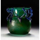 A GREEN GLASS VASE, PROBABLY ROMAN OR LATER