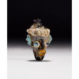 A CARTHAGINIAN GLASS HEAD PENDANT CIRCA 5TH-4TH CENTURY B.C.