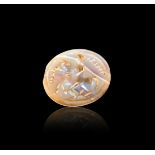 AN INSCRIBED CHALCEDONY STAMP SEAL, ARCHAIC PERIOD, CIRCA LATE 6TH CENTURY B.C.