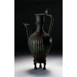 AN EXTREMELY RARE DOUBLE ENDED BRONZE (OINOCHOE) JUG