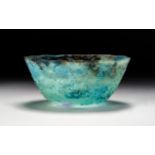 A TURQUOISE GLASS BOWL, PROBABLY HELLENISTIC OR LATER