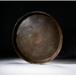 AN ISLAMIC CALLIGRAPHIC INSCRIBED STEEL CHARGER