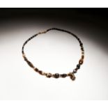 AN EGYPTIAN BANDED AGATE NECKLACE, LATE PERIOD, CIRCA 664-332 B.C