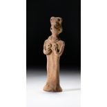 A SYRIAN TERRACOTTA IDOL CIRCA LATE 3RD-EARLY 2ND MILLENNIUM B.C.