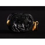 A GREEK INSCRIBED OBSIDIAN SCARAB ON GOLD MOUNTS