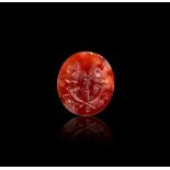 A GRECO PERSIAN CARNELIAN INTAGLIO OF A MARRIAGE SCENE CIRCA 4TH CENTURY A.D.