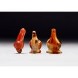 THREE EGYPTIAN AGATE PHALLUS PENDANTS MILLENNIUM B.C. AND LATER