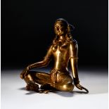 A GILT BRONZE FIGURE OF A SEATED BUDDHA