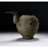A BRONZE SPOUTED PITCHER, LATE BRONZE AGE OR LATER