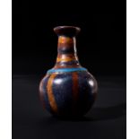 AN EASTERN MEDITERRANEAN GLASS COSMETIC VESSEL, CIRCA 5TH CENTURY B.C.