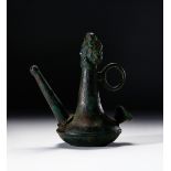 A ROMAN BRONZE FIGURAL OIL LAMP. CIRCA 1ST-2ND CENTURY A.D.