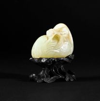 A CHINESE JADE DUCK AND LOTUS GROUP ON A ZITAN STAND, QIANLONG PERIOD (1736-1795)