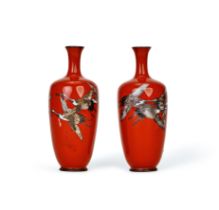 A PAIR OF RED CLOISONNE "FLYING CRANE" VASES, MEIJI PERIOD (1868-1912)