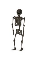 A RARE IRON JIZAI OKIMONO OF A HUMAN SKELETON, MEIJI PERIOD (1868-1912)