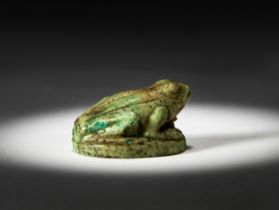 AN EGYPTIAN FELDSPAR FROG AMULET, LATE NEW KINGDOM, CIRCA 1200 B.C.