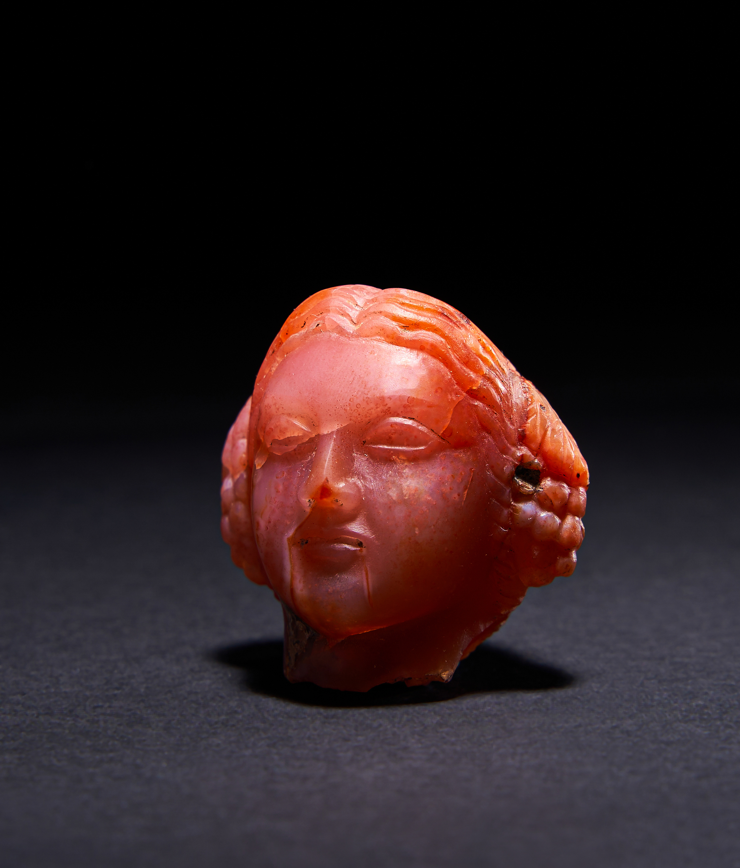 A RARE ROMAN RED CHALCYDONLY HEAD OF THE EMPRESS APOLLO, CIRCA 1ST-2ND CENTURY A.D. - Image 3 of 5