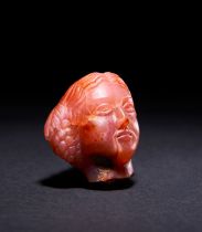 A RARE ROMAN RED CHALCYDONLY HEAD OF THE EMPRESS APOLLO, CIRCA 1ST-2ND CENTURY A.D.