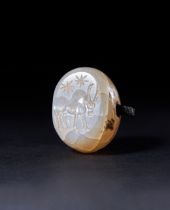 A CHALCEDONY BULL ONLOOKING THE STARS STAMP SEAL, CIRCA 2ND MILLENNIUM B.C OR LATER