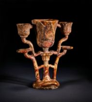 A CARVED EGYPTIAN TRIPLE ALABASTER LAMP