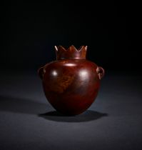 A GREEK JASPER COSMETIC VESSEL IN THE FORM OF A POMEGRANATE, CIRCA 3RD CENTURY A.D.