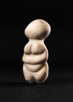 AN ANATOLIAN STONE STANDING MOTHER GODDESS NEOLITHIC PERIOD, CIRCA 6TH MILLENNIUM B.C.