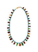 AN EGYPTIAN COLOURED FAIENCE & LIMESTONE BEAD NECKLACE NEW KINGDOM, DYNASTY XVIII-XX, 1550-1070 B.C.