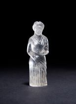 A LARGE ROMAN ROCK CRYSTAL FIGURE OF A DEITY, CIRCA 1ST CENTURY A.D.