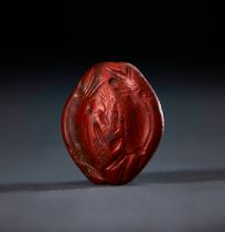 A JASPER MINOAN SEA CREATURES FISH SEAL, MIDDLE MINOAN III-LATE MINOAN I, CIRCA 1700-1500 B.C.