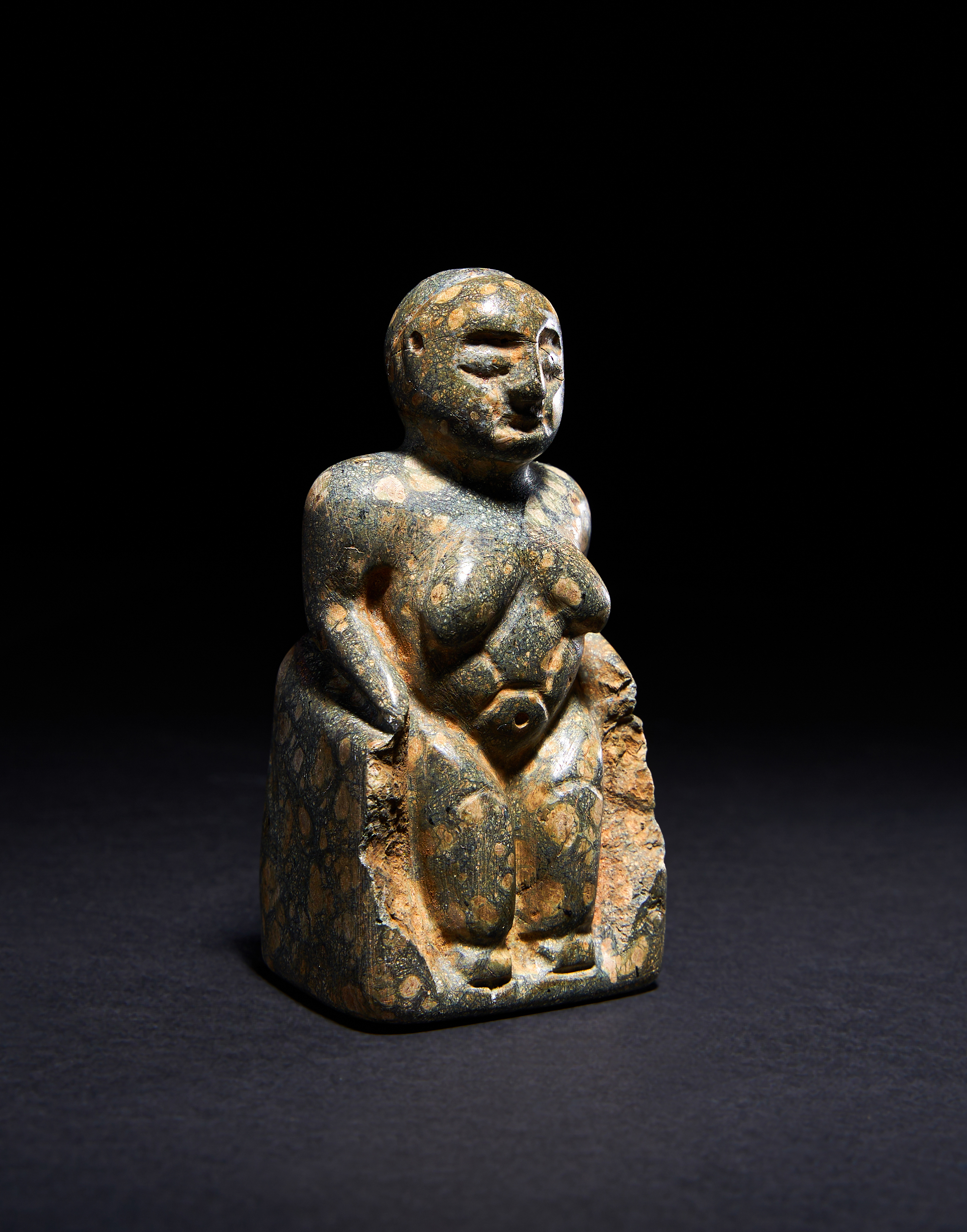 AN ANATOLIAN PATTERNED GREY STEATITE FIGURE OF A MOTHER GODDESS, NEOLITHIC PERIOD, CIRCA 6TH MILLENN