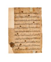 A LARGE FATIMID QURAN LEAF, 9TH-10TH CENTURY, EGYPT