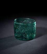 A FATIMID CARVED TURQUOISE GLASS BOWL, EGYPT 9TH CENTURY