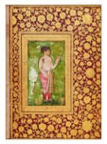 ATTRIBUTED TO THE MUGHAL MASTER MANOHAR, A PORTRAIT OF A PRINCE, MOUNTED ON A ROYAL ALBUM PAGE,INDIA