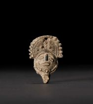 A BRONZE MINIATURE TRIBAL MASK