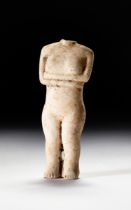 A MARBLE FRAGMENT OF A FEMALE IDOL PROBABLY CYCLADIC