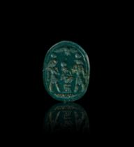 A CLASSICAL PHOENICIAN GREEN JASPER ENGRAVED SCARAB DEPICTING GODS SURROUNDING HORUS AS A CHILD, 5TH