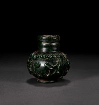 A RARE GREEN AYYUBID GLASS BOTTLE VASE, CIRCA 12TH/13TH CENTURY