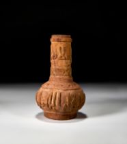 AN ISLAMIC CARVED WOODEN BOTTLE VASE IN THE MANNER OF MAMLUK