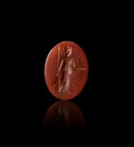 A GREEK CARNELIAN INTAGLIO OF ATHENA IN BATTLE ATTIRE