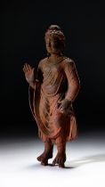 A LARGE BRONZE STANDING BUDDHA