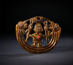 A PRE COLOMBIAN GOLD MOCHE NOSE ORNAMENT DEPICTING SHAMAN, CIRCA 800-1200 A.D